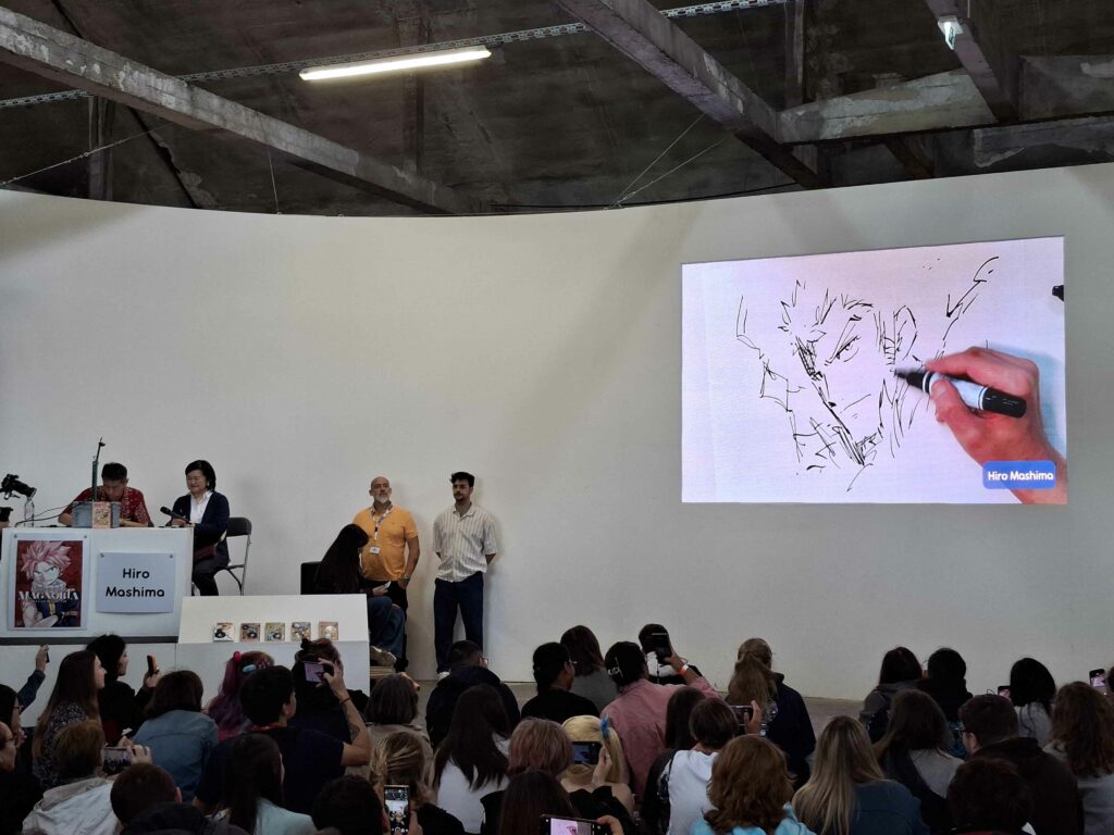 Hiro Mashima aux Rendez-vous de la bande dessinée d'Amiens dessinant Luxus (Fairy Tail)