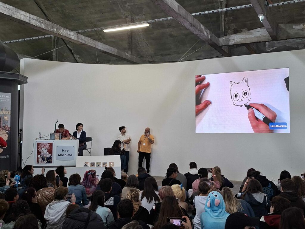 Extrait du dessin live aux Rendez-vous de la bd d'Amiens avec Hiro Mashima en train de réaliser Happy (Fairy Tail).